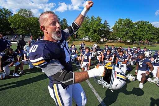 After seeing his first college football game action, Lycoming College nose tackle Tom Cillo (40) and teammates celebrate a 23-16 win over King's College in an NCAA Division III junior varsity college football game in Williamsport, Pa., Sunday, Sept. 28, 2025. (AP Photo/Gene J. Puskar)