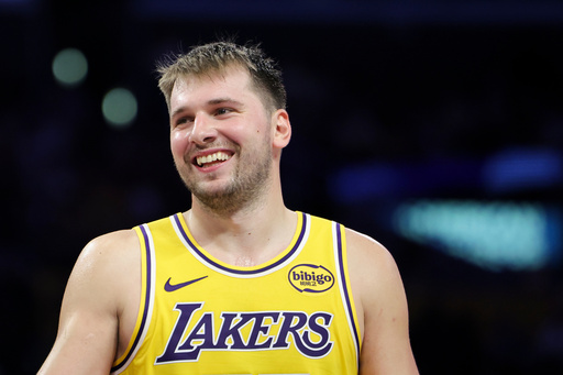 Los Angeles Lakers guard Luka Doncic reacts against the Minnesota Timberwolves during the second half of an NBA basketball game, Friday, Oct. 24, 2025, in Los Angeles. (AP Photo/Jessie Alcheh)