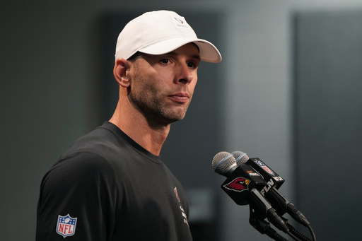 Arizona Cardinals head coach Jonathan Gannon pauses before answering a question during a news conference after an NFL football game against the Tennessee Titans Sunday, Oct. 5, 2025, in Glendale, Ariz. (AP Photo/Rick Scuteri)