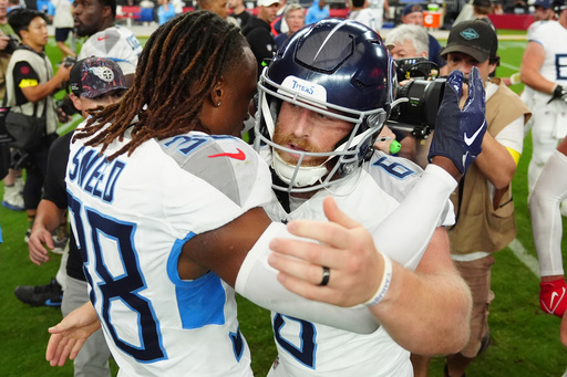 Tennessee Titans cornerback L'Jarius Sneed (38) congratulates place-kicker Joey Slye (6) after kicking the game winning field goal in an NFL football game against the Arizona Cardinals, Sunday, Oct. 5, 2025, in Glendale, Ariz. (AP Photo/Ross D. Franklin)