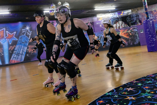 FILE - Members of the Long Island Roller Rebels practice, Mar. 19, 2023, at United Skates of America, in Seaford, NY. (AP Photo/Jeenah Moon, File)