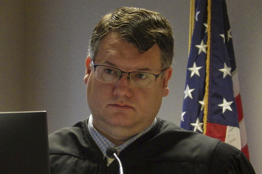 North Dakota State District Judge Jackson Lofgren listens during a court hearing on March 31, 2025, at the Burleigh County Courthouse in Bismarck, N.D. (AP Photo/Jack Dura)
