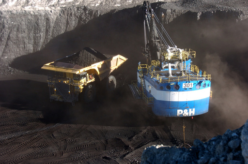 FILE - A haul truck is seen after being loaded with coal by a mechanized shovel at the Spring Creek mine, in this Nov. 15, 2016 photo, near Decker, Mont. (AP Photo/Matthew Brown)