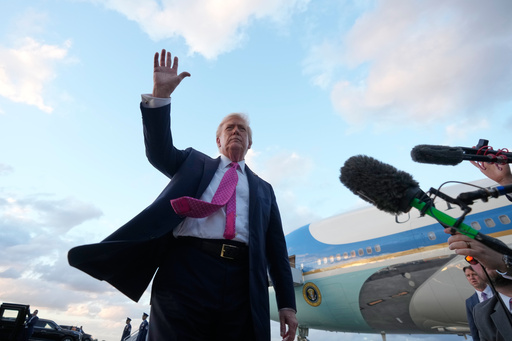 President Donald Trump waves after arriving on Air Force One, Friday, Oct. 17, 2025, at Palm Beach International Airport in West Palm Beach, Fla. (AP Photo/Mark Schiefelbein)