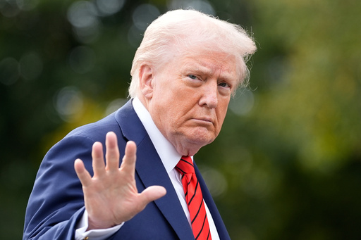 President Donald Trump walks on the South Lawn after arriving on Marine One at the White House, Friday, Oct. 10, 2025, in Washington. (AP Photo/Alex Brandon)