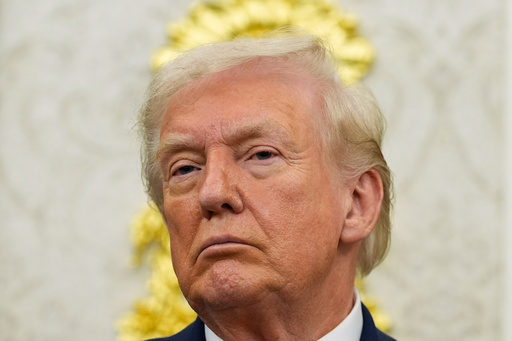 President Donald Trump listens during an event in the Oval Office of the White House, Friday, Oct. 10, 2025, in Washington. (AP Photo/Alex Brandon)