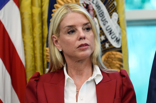Attorney General Pam Bondi listens as President Donald Trump signs a presidential memorandum on the death penalty in the District of Columbia in the Oval Office at the White House, Thursday, Sept. 25, 2025, in Washington. (AP Photo/Alex Brandon)