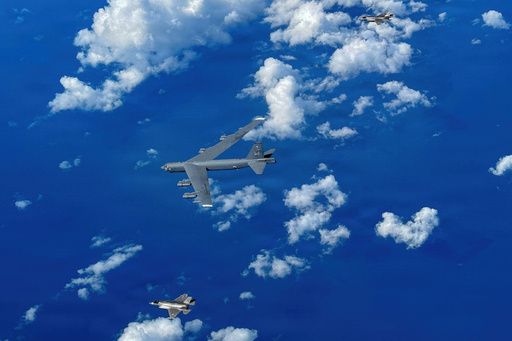 In this image provided by the U.S. Air Force, A Marine Corps F-35B Lightning II aircraft flies alongside a U.S. Air Force B-52H Stratofortress bomber in the U.S. Southern Command area of responsibility, Oct. 15, 2025. (U.S. Air Force via AP)