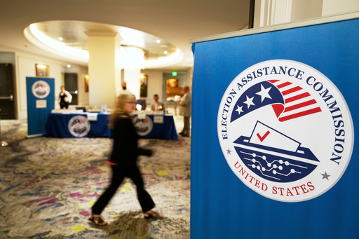 FILE - A person arrives for a U.S. Election Assistance Commission Standards Board public meeting, April 24, 2025, in Charlotte, N.C. (AP Photo/Chris Carlson, File)