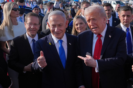 President Donald Trump poses for a photo with Israel's Prime Minister Benjamin Netanyahu before he boards Air Force One at Ben Gurion International Airport, Monday, Oct. 13, 2025, near Tel Aviv, as Israel's President Isaac Herzog, left, watches. (AP Photo/Evan Vucci)