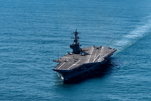 The USS George H.W. Bush aircraft carrier sails in the Atlantic Ocean off the coast of Norfolk, Va., Saturday, Oct. 4, 2025. (AP Photo/Alex Brandon, Pool)