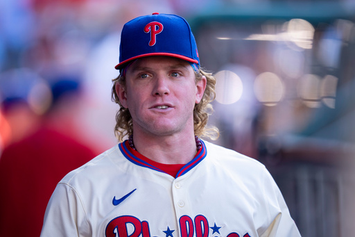 Philadelphia Phillies' Harrison Bader looks on from the dugout during the sixth inning of a baseball game against the Minnesota Twins, Sunday, Sept. 28, 2025, in Philadelphia. (AP Photo/Chris Szagola)