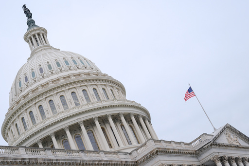 The American flag flies atop the Capitol Building, Monday, Sept. 29, 2025, in Washington. (AP Photo/Mariam Zuhaib)