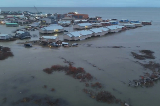 In this aerial photo provided by the Alaska Department of Transportation and Public Facilities, the city of Kotzebue, Alaska, experiences flooding, Wednesday, Oct. 8, 2025. (Alaska Department of Transportation and Public Facilities via AP)