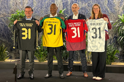 From left to right, Mexican Football Federation president Mikel Arriola, Jamaica Football Federation president Michael Ricketts, Costa Rican Football Federation president Osael Maroto Martínez and U.S. Soccer president Cindy Parlow Cone pose with jerseys at a news conference in New York, Monday, Oct. 20, 2025, to announce the four nations had joined a proposal to co-host the 2031 Women's World Cup, the only bid being considered by FIFA. (AP Photo/Ron Blum)