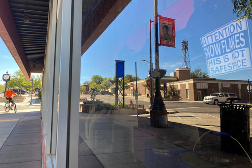 FILE - A shirt makes a political statement in a storefront in Gillette, Wyo., Sept. 21, 2021. (AP Photo/Mead Gruver, File)