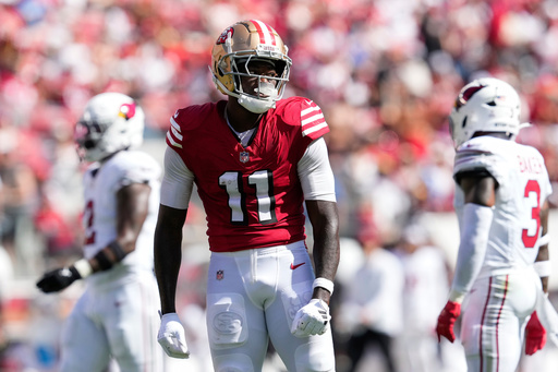 FILE - San Francisco 49ers wide receiver Brandon Aiyuk (11) reacts during the first half of an NFL football game against the Arizona Cardinals, Oct. 6, 2024, in Santa Clara, Calif. (AP Photo/Godofredo A. Vásquez, File)