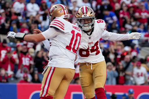 San Francisco 49ers quarterback Mac Jones (10) and wide receiver Russell Gage (84) celebrate after a touchdown against the New York Giants during the fourth quarter of an NFL football game, Sunday, Nov. 2, 2025, in East Rutherford, N.J. (AP Photo/Seth Wenig)