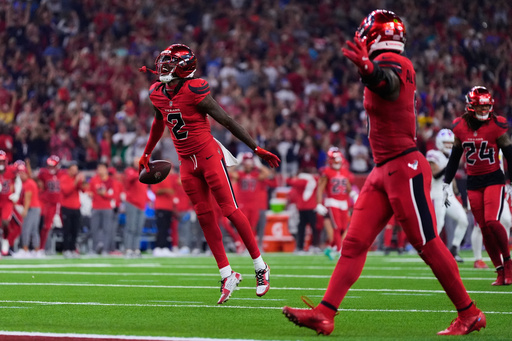 Houston Texans safety Calen Bullock (2) celebrates after intercepting a Buffalo Bills' Josh Allen pass in the second half of an NFL football game Thursday, Nov. 20, 2025, in Houston. (AP Photo/Ashley Landis)