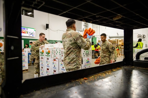 California National Guard sort produce at the Los Angeles Food Bank Wednesday, Oct. 29, 2025, in Los Angeles. (AP Photo/Ethan Swope)