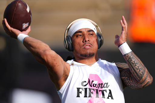 Arizona quarterback Noah Fifita warms up before an NCAA college football game against Colorado Saturday, Nov. 1, 2025, in Boulder, Colo. (AP Photo/David Zalubowski)