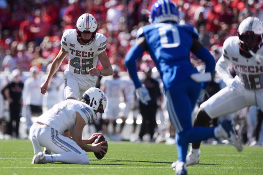 Texas Tech place kicker Stone Harrington (48) kicks a field goal during the first half of an NCAA college football game against BYU, Saturday, Nov. 8, 2025, in Lubbock, Texas. (AP Photo/Annie Rice)