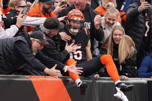 Cincinnati Bengals wide receiver Charlie Jones (15) celebrates his opening kickoff return touchdown during the first half of an NFL football game against the Chicago Bears, Sunday, Nov. 2, 2025, in Cincinnati. (AP Photo/Joshua A. Bickel)