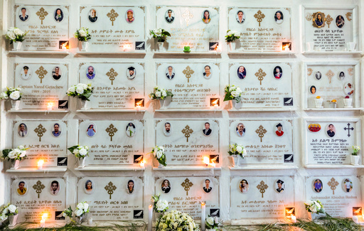 FILE - Candles are lit on a memorial wall during an anniversary service at the Holy Trinity Cathedral in Addis Ababa, Ethiopia, March 8, 2020, to remember those who died in the Ethiopian Airlines flight ET302 crash. (AP Photo/Mulugeta Ayene, File)