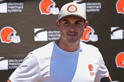 FILE - Tommy Rees, Cleveland Browns tight ends coach, answers a question at a news conference during an NFL football practice in Berea, Ohio, June 13, 2024. (AP Photo/Sue Ogrocki, File)