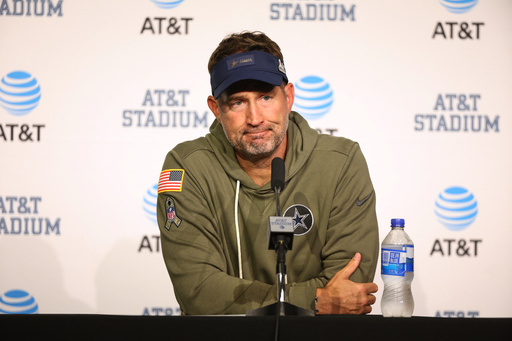 Dallas Cowboys head coach Brian Schottenheimer takes questions during a news conference after an NFL football game against the Arizona Cardinals Monday, Nov. 3, 2025, in Arlington, Texas. (AP Photo/Richard Rodriguez)