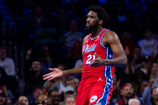 Philadelphia 76ers' Joel Embiid reacts after a basket and a foul during the first half of an NBA Cup basketball game against the Boston Celtics, Friday, Oct. 31, 2025, in Philadelphia. (AP Photo/Chris Szagola)
