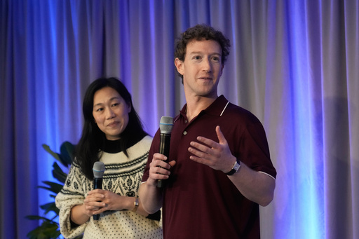 Meta CEO Mark Zuckerberg, right, speaks next to his wife, Priscilla Chan, co-founder and co-CEO of the Chan Zuckerberg Initiative (CZI), during an event at the Biohub Imaging Institute in Redwood City, Calif., Wednesday, Nov. 5, 2025. (AP Photo/Jeff Chiu)