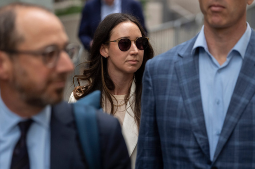 FILE - Charlie Javice, center, exits Manhattan federal court, Sept. 29, 2025, in New York. (AP Photo/Yuki Iwamura, File)