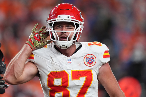 Kansas City Chiefs tight end Travis Kelce celebrates after scoring during the second half an NFL football game against the Denver Broncos Sunday, Nov. 16, 2025, in Denver. (AP Photo/David Zalubowski)