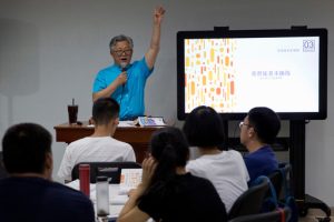 FILE - Pastor Ezra Jin Mingri leads a class on the basics of Christian beliefs at Zion Church in Beijing, Aug. 4, 2018. (AP Photo/Ng Han Guan, File)