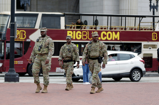 National Guard soldiers patrol at Union Station, Tuesday, Oct. 28, 2025, in Washington. (AP Photo/Rahmat Gul)