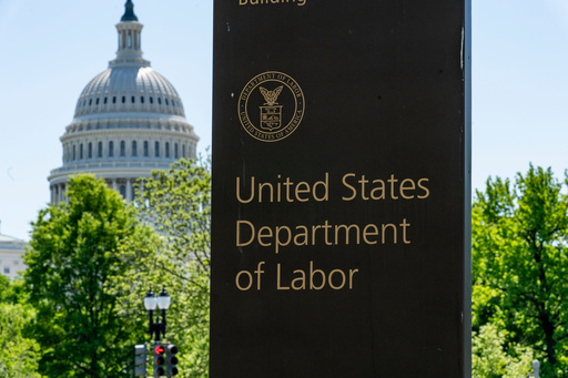 FILE - In this May 7, 2020, file photo, the entrance to the Labor Department is seen near the Capitol in Washington. (AP Photo/J. Scott Applewhite, File)