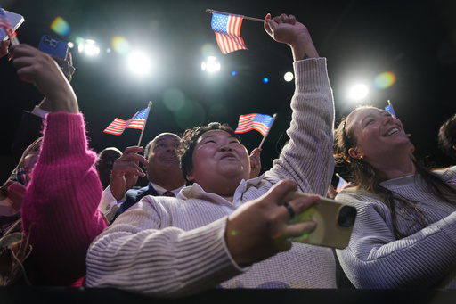 People cheer as Democrat Abigail Spanberger walks out on stage after she was declared the winner of the Virginia governor's race during an election night watch party Tuesday, Nov. 4, 2025, in Richmond, Va. (AP Photo/Stephanie Scarbrough)