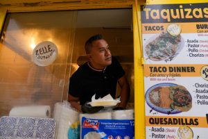 Rafael Hernandez, originally from Mexico, sells food from his family's food truck, Nov. 6, 2025, in Chicago. (AP Photo/Erin Hooley)