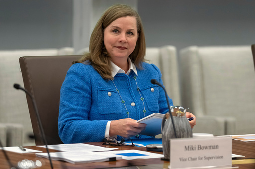 FILE - Michelle Bowman, Vice Chair for Supervision of the Federal Reserve Board of Governors, takes a seat for an open meeting of the Board of Governors at the Federal Reserve, in Washington, June 25, 2025. (AP Photo/Mark Schiefelbein, File)