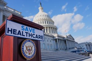 A podium is prepared before Democrats hold news conference on the health care funding fight on the steps of the House before votes to end the government shutdown, on Capitol Hill, Wednesday, Nov. 12, 2025, in Washington. (AP Photo/Mariam Zuhaib)