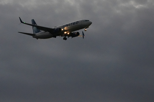 An United Airlines flight arrives at O'Hare International Airport in Chicago, Monday, Nov. 3, 2025. (AP Photo/Nam Y. Huh)