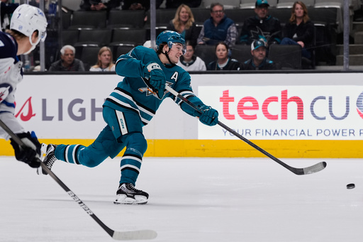 San Jose Sharks center Macklin Celebrini (71) shoots during the first period of an NHL hockey game against the Winnipeg Jets, Friday, Nov. 7, 2025, in San Jose, Calif. (AP Photo/Godofredo A. Vásquez)