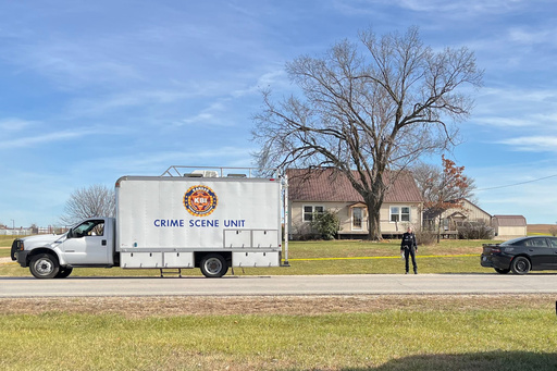 This photo provided by the Kansas Bureau of Investigation shows a crime scene truck parked in front of the home where a domestic violence incident resulted in multiple casualties, Saturday, Nov. 15, 2025, in Carbondale, Kan. (Kansas Bureau of Investigation via AP)