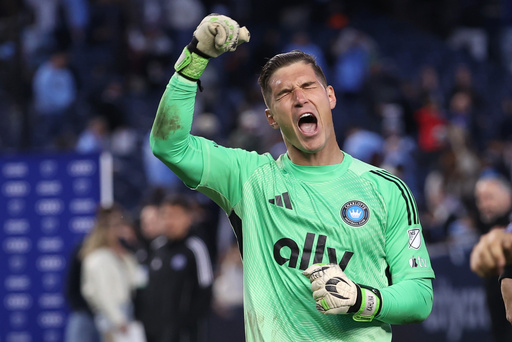 Charlotte FC goalkeeper Kristijan Kahlina (1) reacts after defeating New York City FC in a shoot out in the first round of MLS soccer's Eastern Conference playoffs Saturday, Nov. 1, 2025, in New York. (AP Photo/Pamela Smith)