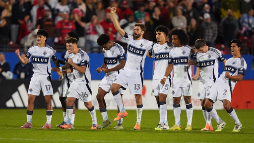 The Vancouver Whitecaps line celebrate a penalty kick goal scored by Belal Halbouni during Game 2 in the first round of MLS soccer's Western Conference playoffs against the FC Dallas in Frisco, Texas, Saturday, Nov. 1, 2025. (AP Photo/LM Otero)