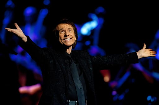 FILE - Singer Miguel Rafael Martos Sánchez of Spain, better known as Raphael, performs at the Royal Theatre in Madrid, Spain on July 22, 2015. (AP Photo/Abraham Caro Marin, File)