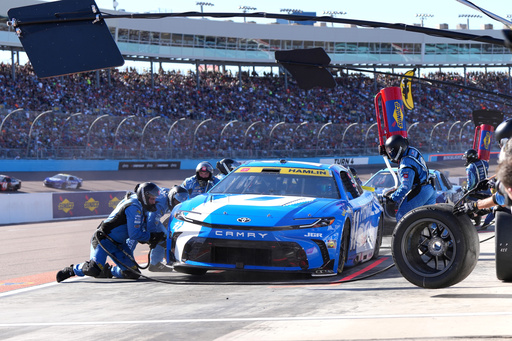 Denny Hamlin makes a pit stop on lap 63 during a NASCAR Cup Series auto race Sunday, Nov. 2, 2025, in Avondale, Ariz. (AP Photo/Rick Scuteri)