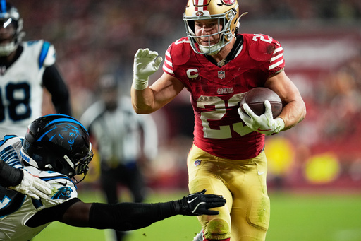 San Francisco 49ers running back Christian McCaffrey runs for a touchdown against the Carolina Panthers during the second half an NFL football game, Monday, Nov. 24, 2025, in Santa Clara, Calif. (AP Photo/Godofredo A. Vásquez)