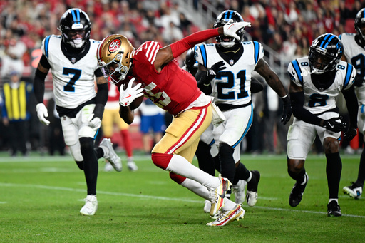 San Francisco 49ers wide receiver Jauan Jennings runs for a touchdown against the Carolina Panthers during the first half an NFL football game, Monday, Nov. 24, 2025, in Santa Clara, Calif. (AP Photo/Eakin Howard)